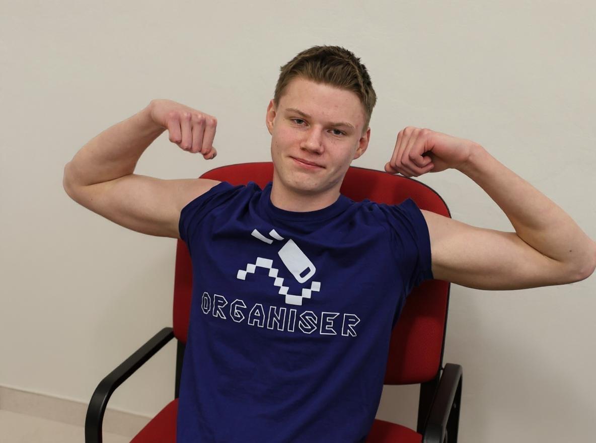 Remove all the background except the chair he is sitting on. Turn him and the chair around.