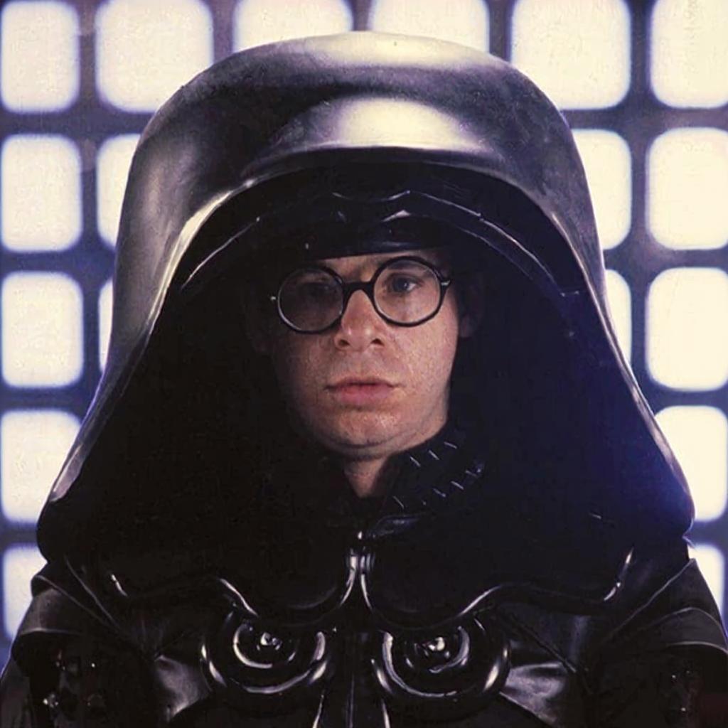 Place the face from the second image into the helmet on the first image.