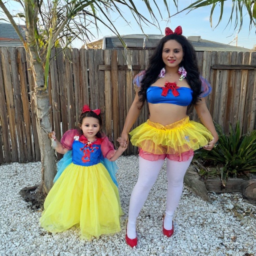 mother-and-daughter-in-party-costume-9xgsap2vr9