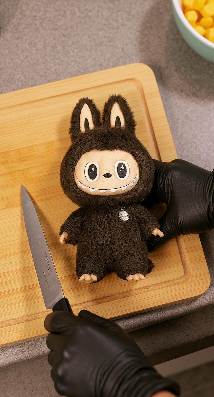 place-the-toy-on-a-wooden-cutting-board-2hr69f1dy5