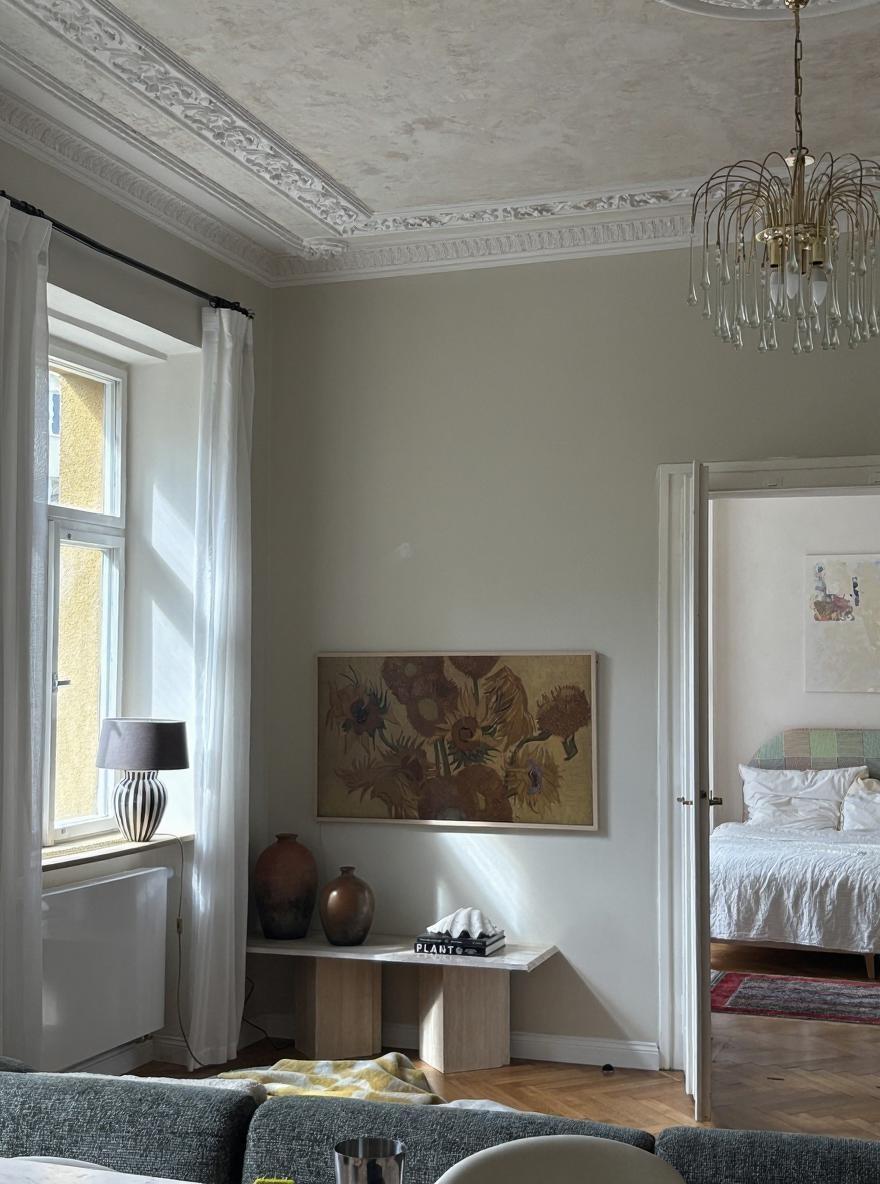Add french molding to this wall above the painting and around it 