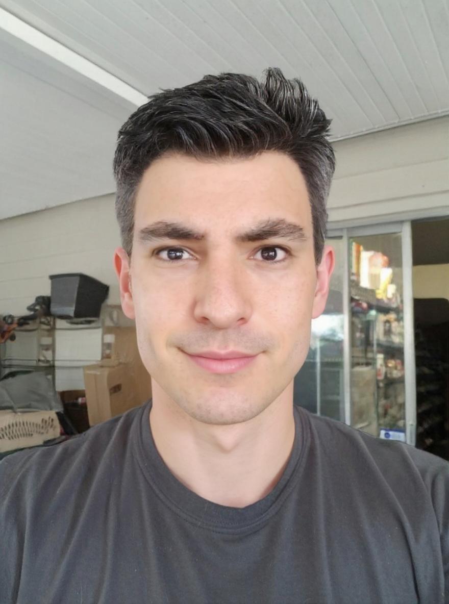 “In this image,

keep the facial features exactly the same (eyes, nose, lips, skin pores—every detail preserved),

transform the head shape into a classic oval: make the face noticeably longer than it is wide, keep the cheekbones as the widest horizontal point, and soften the jawline so it tapers gently to a rounded chin,

modify the neck to be slender and proportionally longer relative to the head and shoulders,

change the skin tone to a fair/light complexion with neutral-to-slightly-pink undertones visible on the cheeks and forehead under the same indoor lighting—while preserving the original lighting, background, pose, and expression.