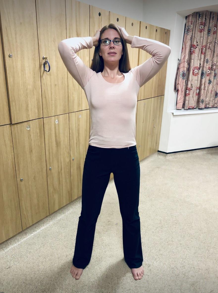 she-is-standing-with-her-legs-open-and-her-hands-p6p5gingns