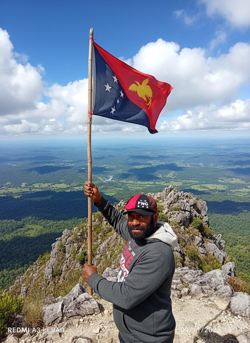 holding-up-the-papua-new-guinea-flag-and-standing-5p4i4ao3t1