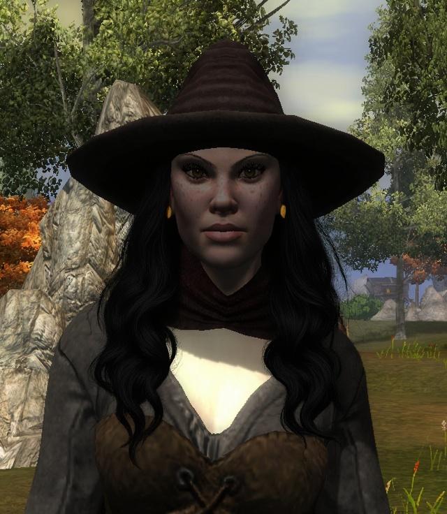 wavy-black-hair-under-hat-earrings-visible-a2x3i9s1mn