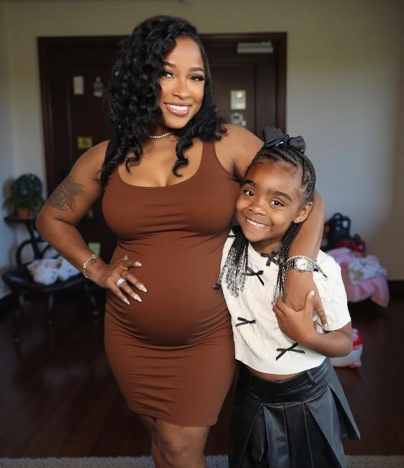 woman-pregnant-and-little-girl-kissing-her-mom-pqzvcx8qn9