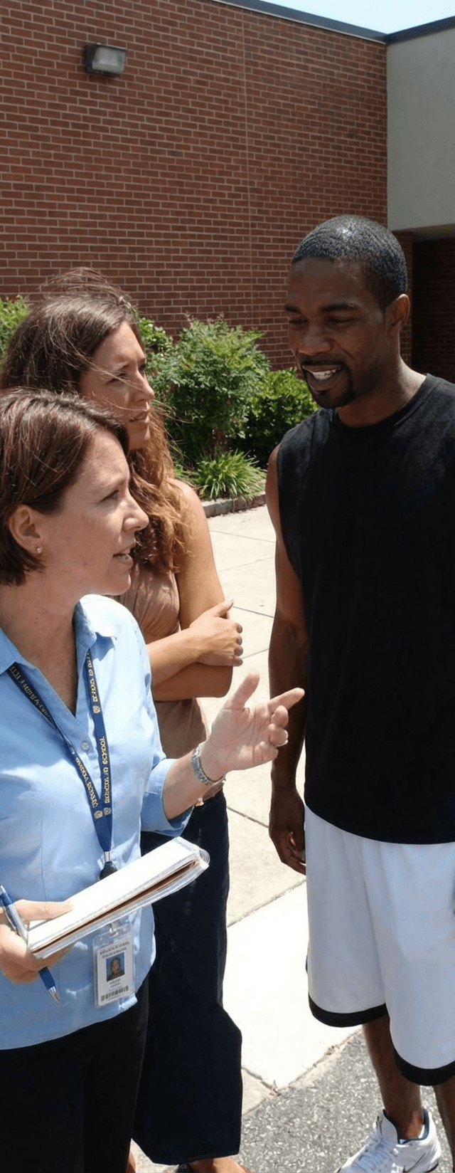 teacher-talks-to-woman-while-black-man-listens-a55k9dqosr-2