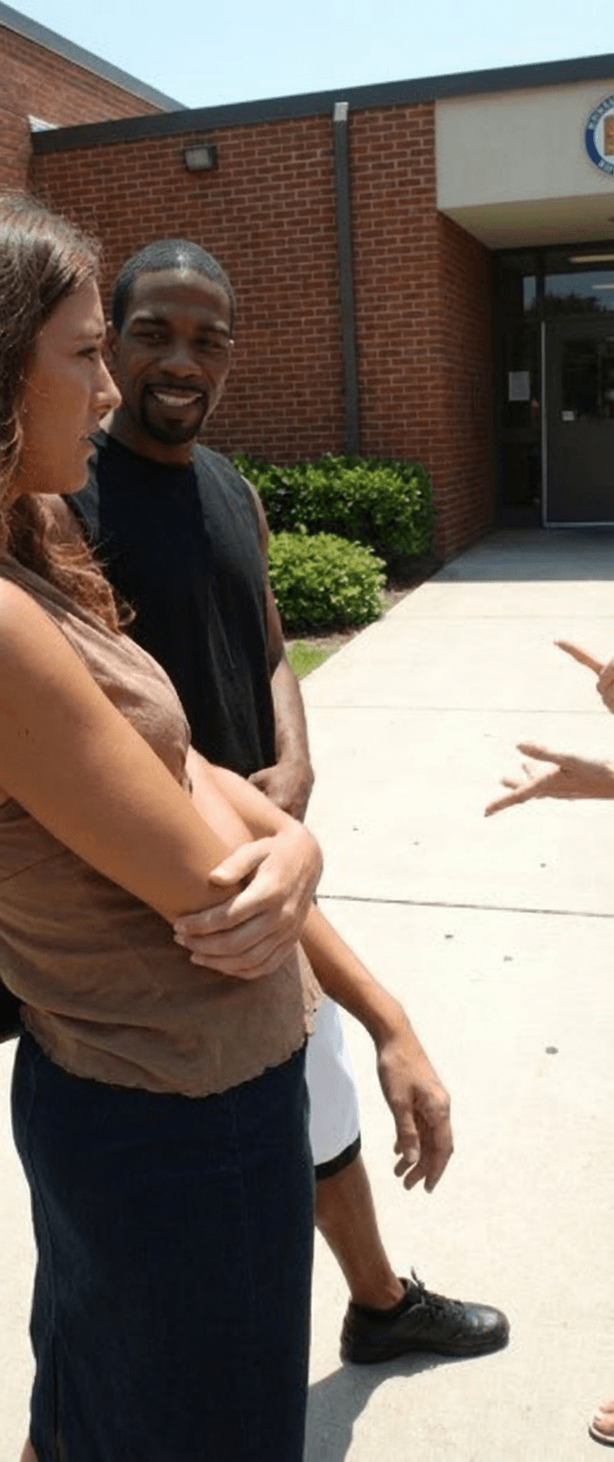 teacher-talks-to-woman-while-black-man-listens-k8pjtww9ht