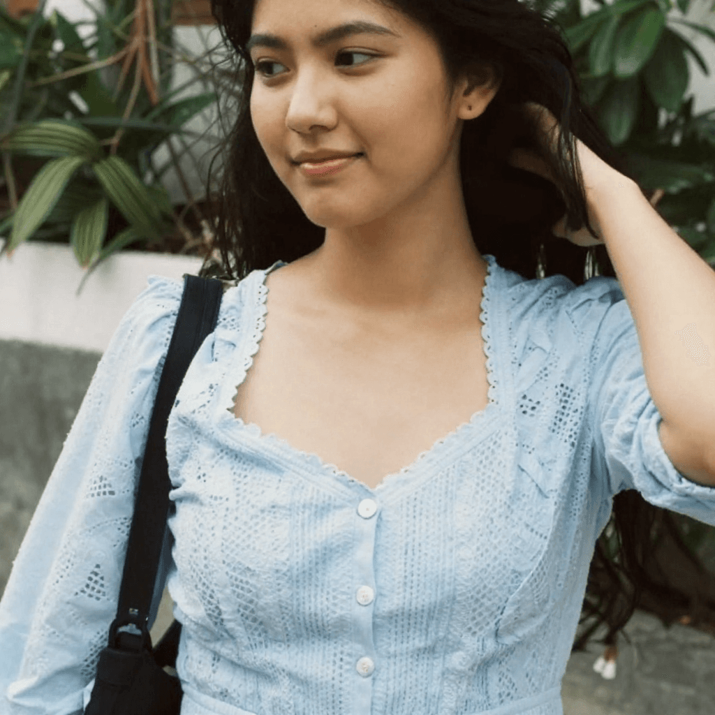 wearing-a-lacy-top-and-flowy-extremely-short-skirt-cth5jv9wy