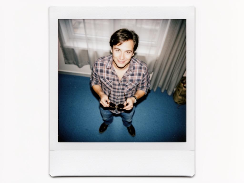 the-image-is-a-polaroid-photograph-of-a-person-frj8c47vpz