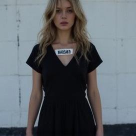 a-blonde-girl-dressed-in-a-black-dress-in-an-vnqrmijdaz