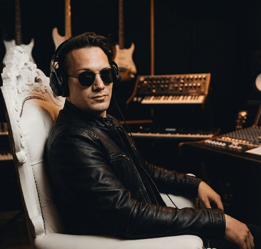 a-man-sitting-on-a-throne-like-white-chair-posed-m0li6wet4j