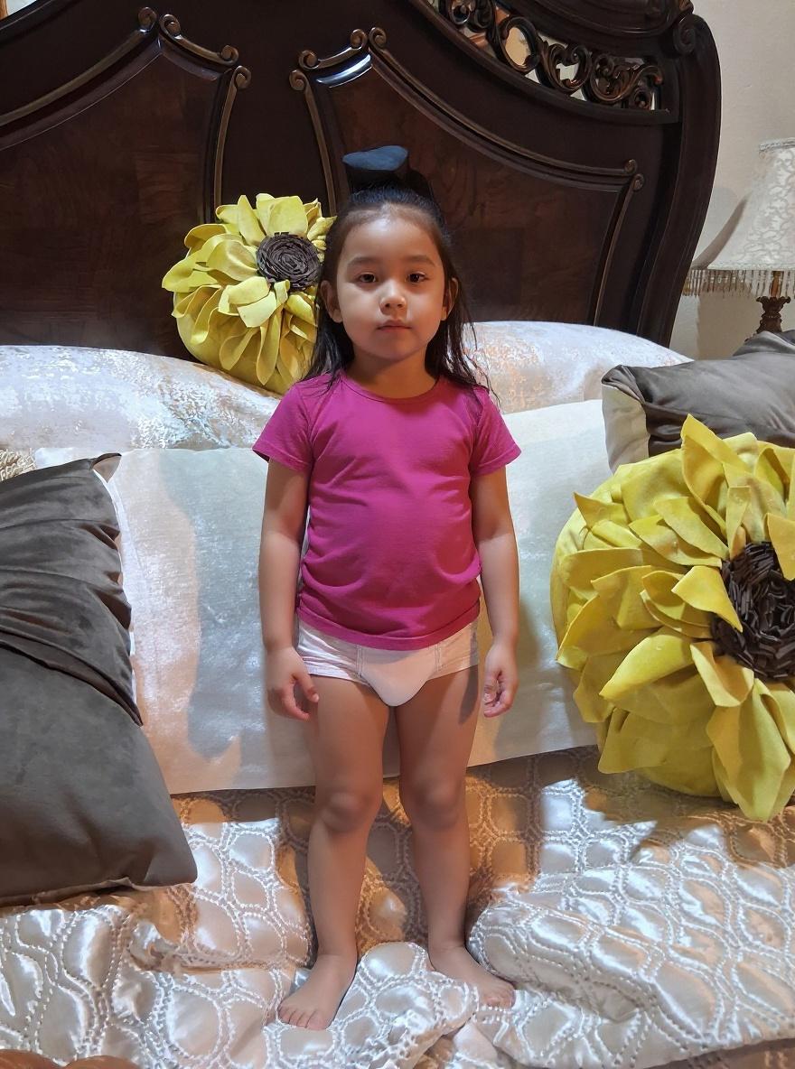 make-the-little-girls-age-5-standing-up-wearing-7t5hfmcvhj