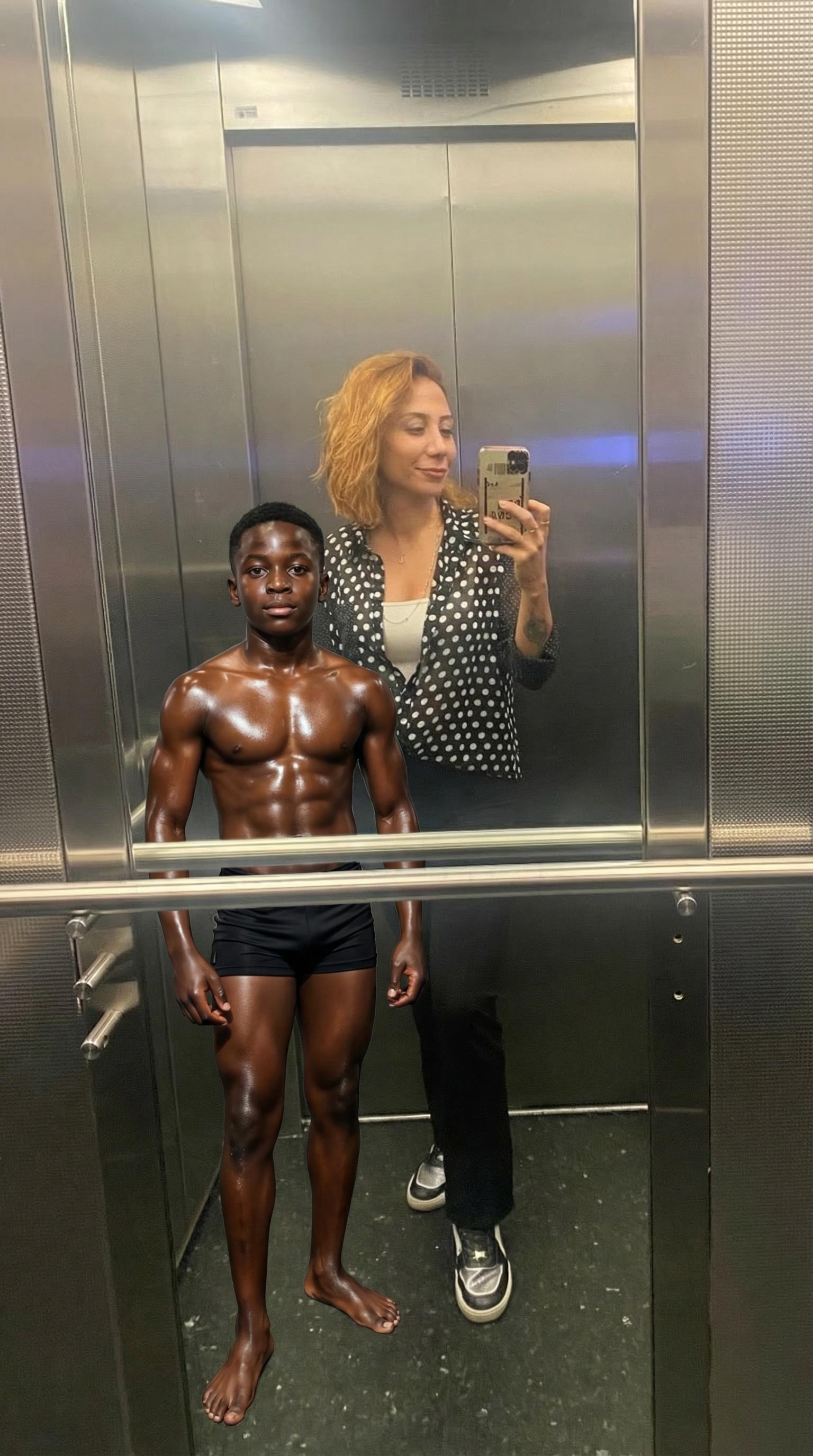 a-muscular-oil-body-black-skinned-boy-in-black-v2v9geskld