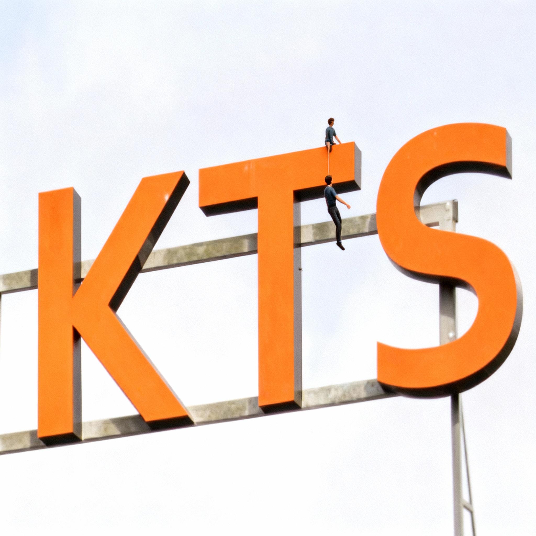 tiny-human-hanging-at-the-t-like-it-is-falling-oq010cxgmw