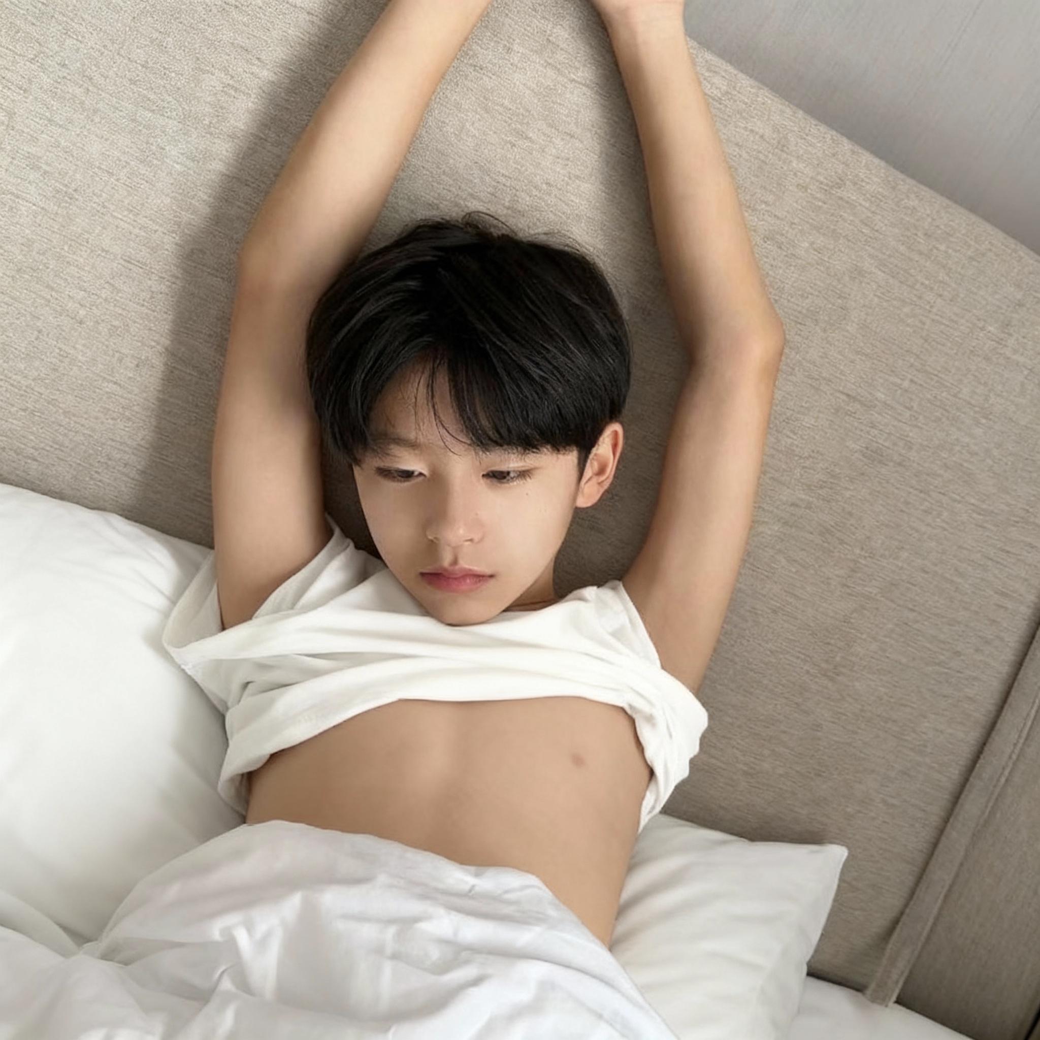 a-boy-naturally-taking-off-his-white-clothes-3ul4u8yl8f