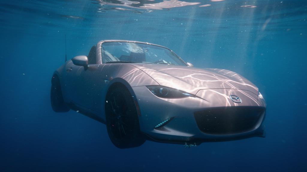 cinematic-underwater-photograph-of-a-pink-mazda-mx-11sgg10kv