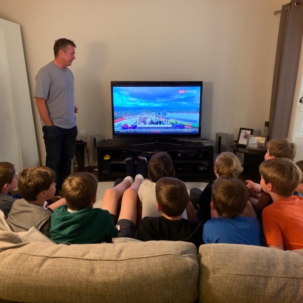 12-boys-watching-tv-with-buts-up-dad-standing-vkte09qxqi-4