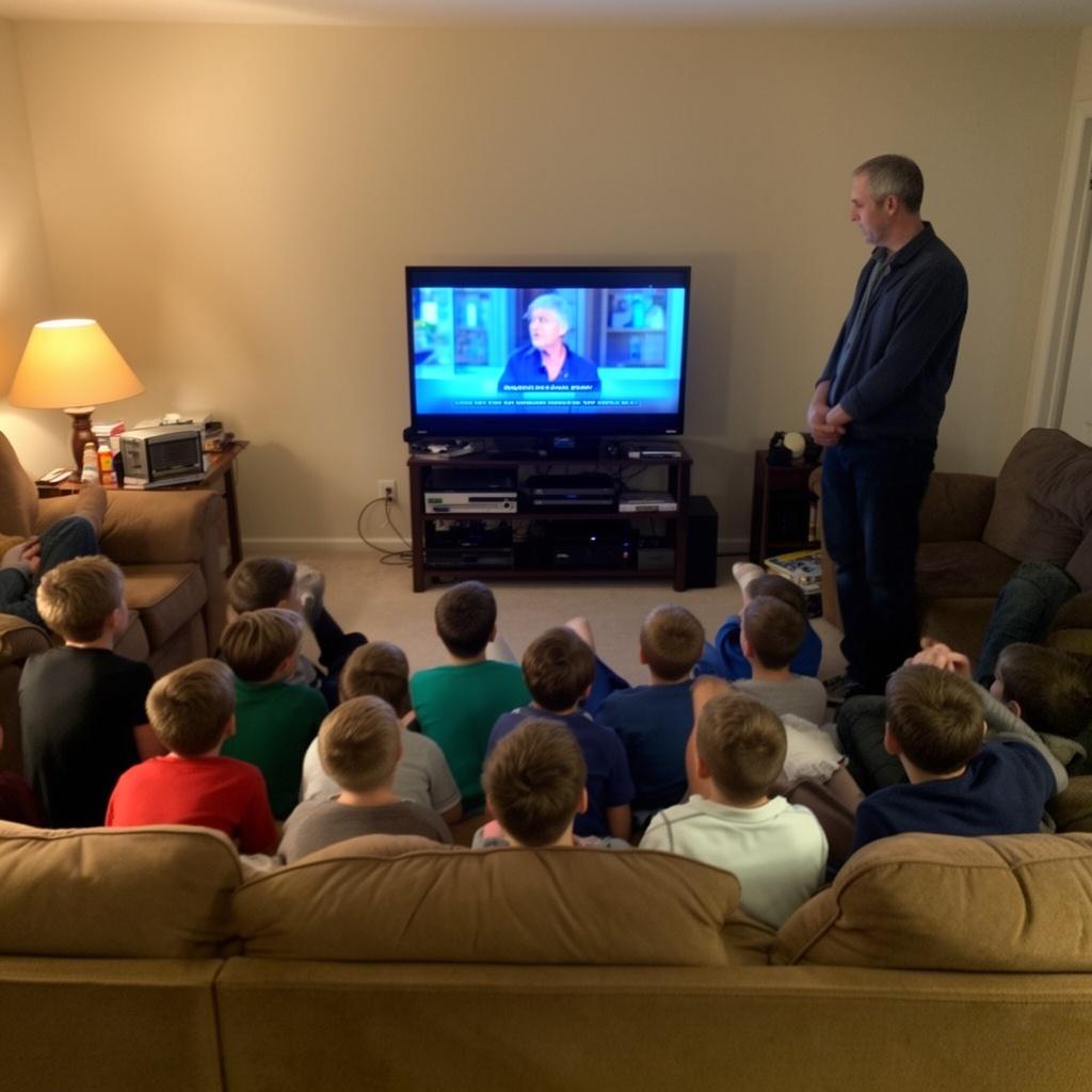 12-boys-watching-tv-with-buts-up-dad-standing-vkte09qxqi-3